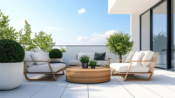A modern, furnished roof terrace with large, light-coloured tile pavers