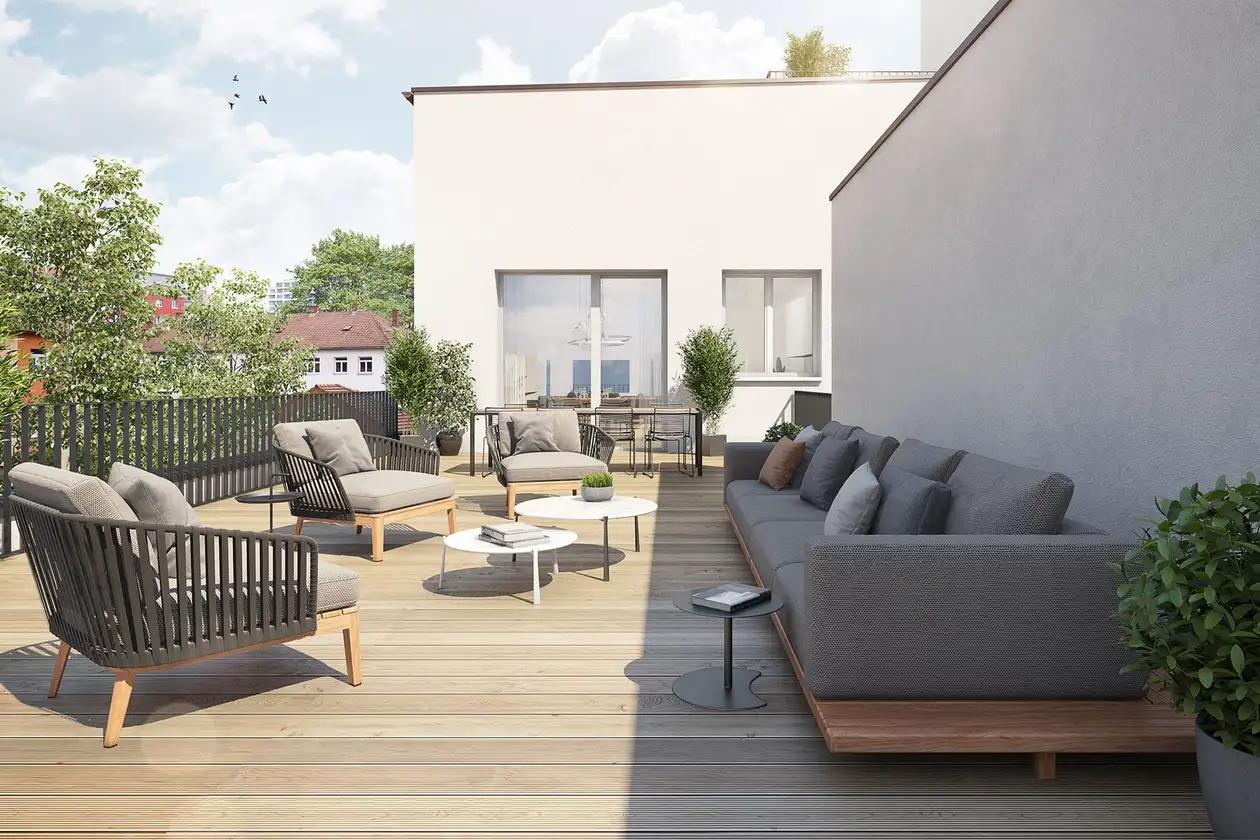 Roof terrace with a view of nearby trees, complete with upholstered furniture in grey