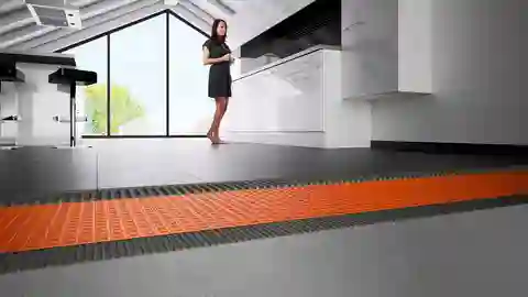 Cross-section through the floor construction of a kitchen with tiles and DITRA mat