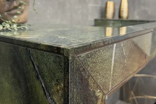 KERDI-BOARD-W washbasin with green patterned tile covering and matching printed profile edges.