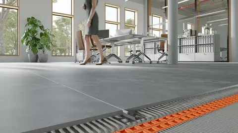 Photo of a floor assembly with screed, uncoupling mat, tiles and DILEX-F being used in an office with a woman who is walking across the floor.