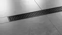 Shower with KERDI-LINE-B drainage channel in matte black