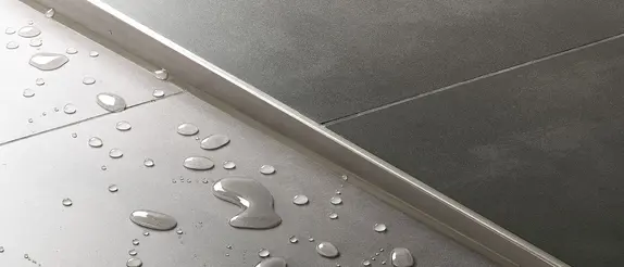 Detailed view of a SHOWERPROFIL system in a floor-level shower.