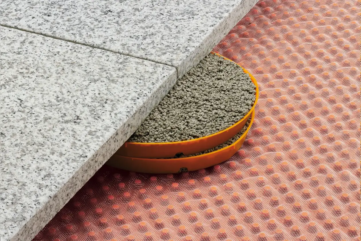 Schl&uuml;ter-Systems terrace assembly B.7 Covering assembly with TROBA-STELZ mortar rings