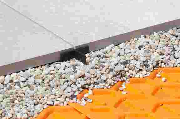 Terrace pavers on a crushed stone layer with a tile spacer to maintain spacing