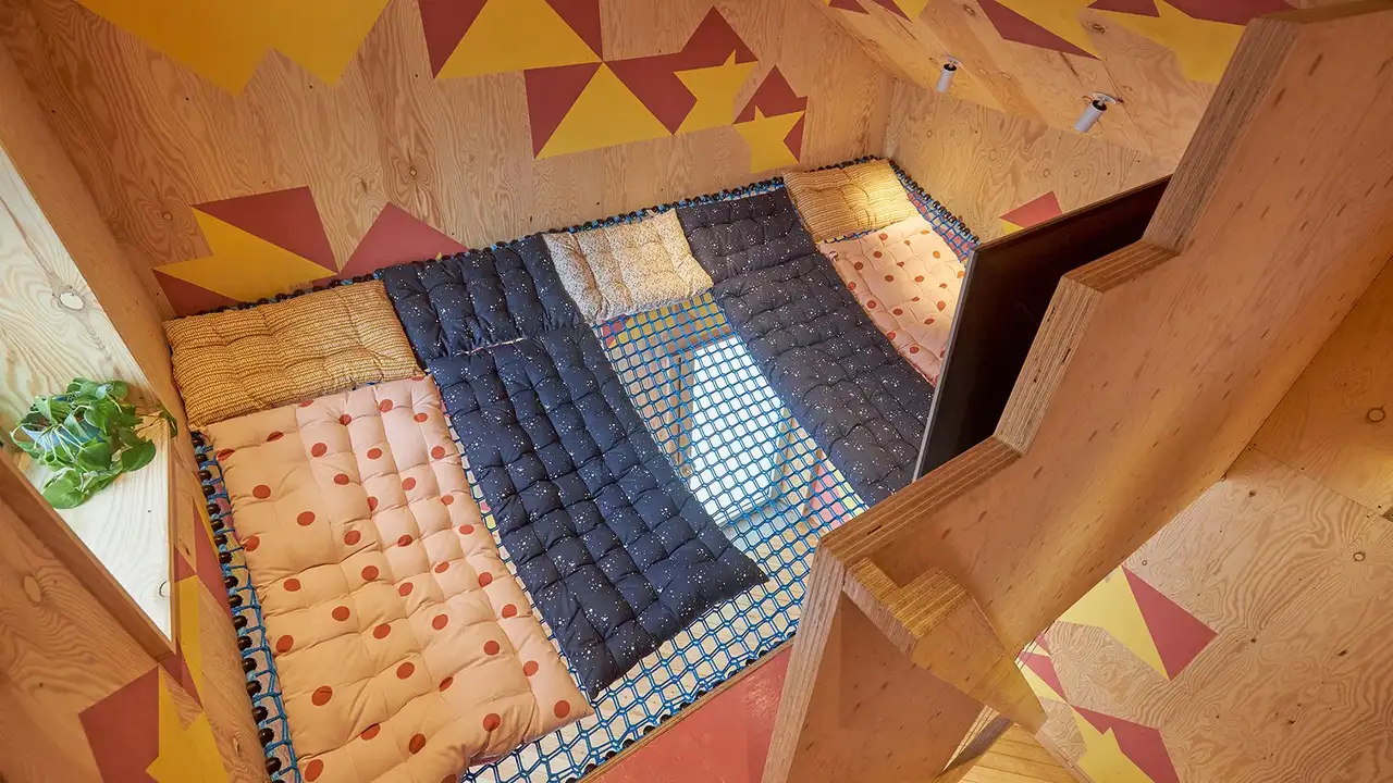 Raised ground floor with mesh netting for the base to create a ‘playful’ space