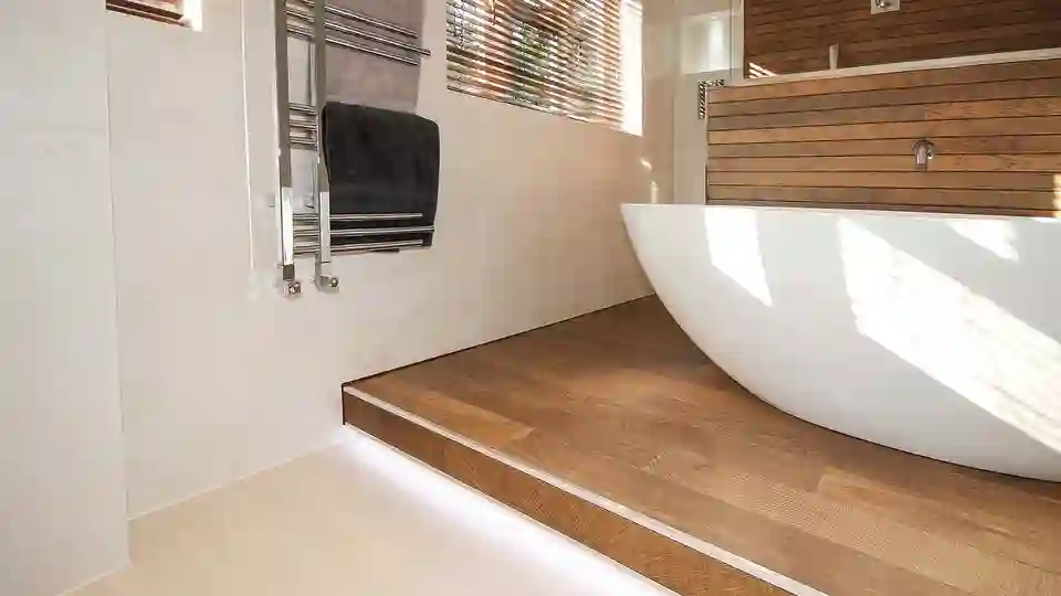 Close-up view of the step leading to a freestanding bathtub