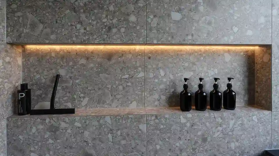 Wall of the floor-level shower with illuminated niche in detail