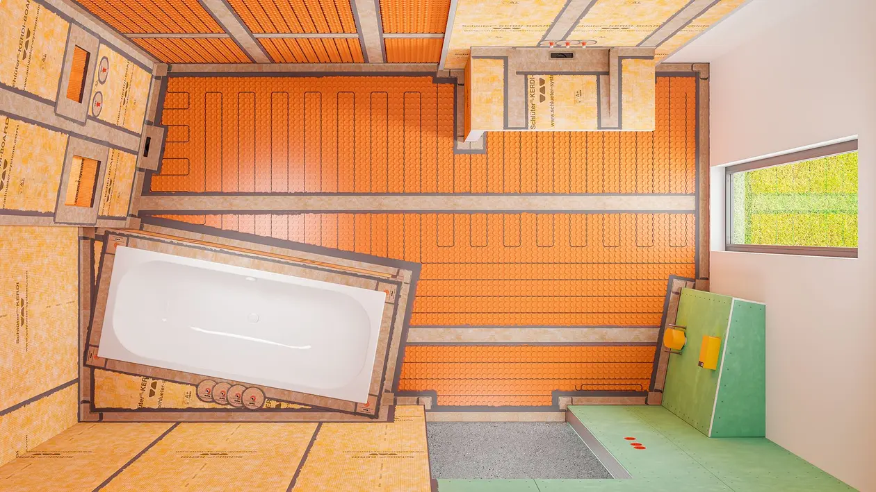 Ein fertig abgedichtetes Badezimmer im Rohbauzustand mit verklebten Entkopplungsmatten und Verlegeuntergründen