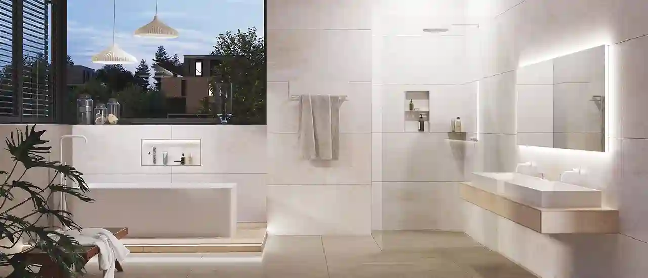 Salle de bains lumineuse avec baignoire sur pieds, douche accessible et nombreux produits Schlüter.