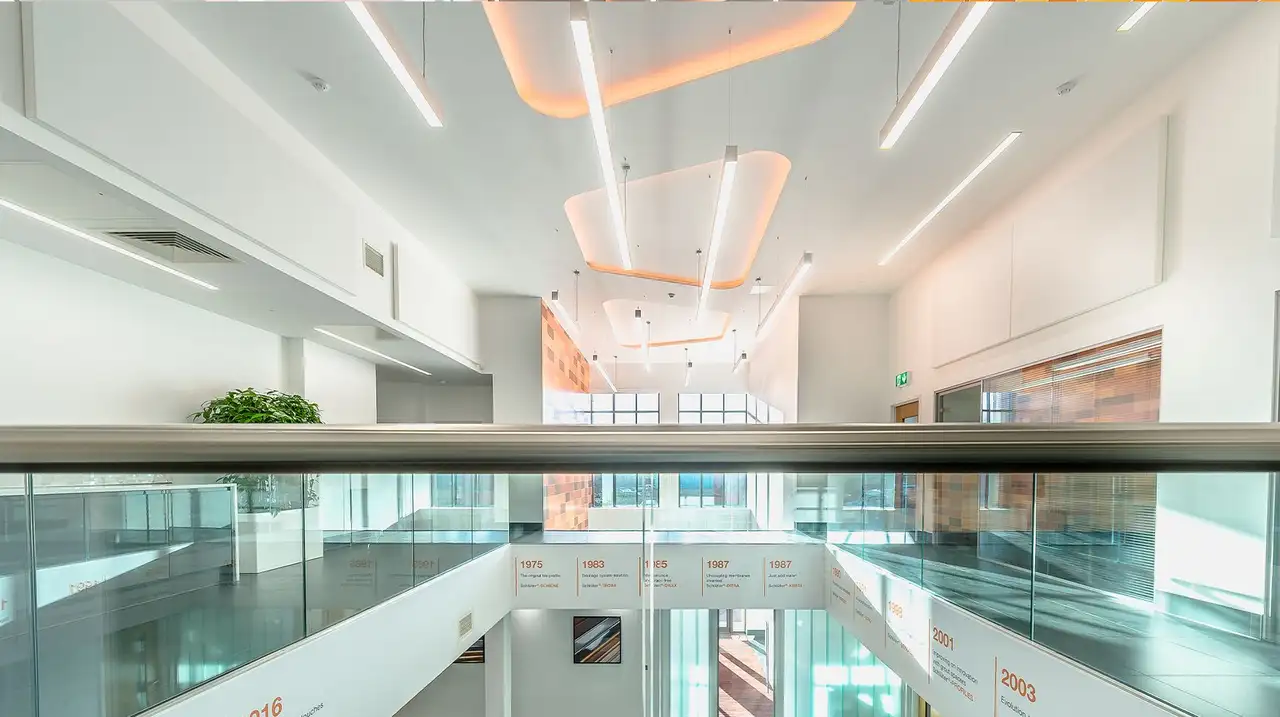 The atrium shows the upper and lower floors of Schlüter-Systems Ltd and the Schlüter trapezoid on the ceiling