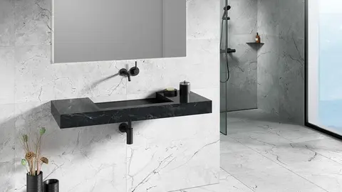 Black marbled tiled KERDI-BOARD-WW vanity unit with matte black wall-mounted mixer tap