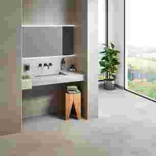 Washbasin unit in a bathroom with concrete-look tiling and matching edge profiles with light grey TRENDLINE finish
