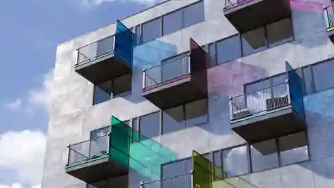 External facade of a building with balconies with colourfully coated balcony edge profiles
