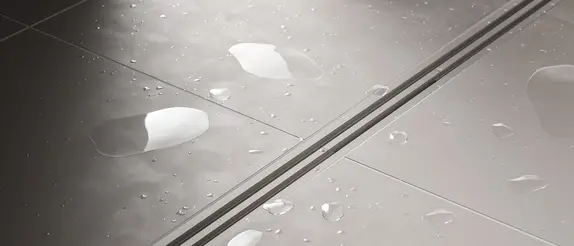 Floor-level shower with length-variable Schlüter-KERDI-LINE-VARIO shower channel in WAVE design