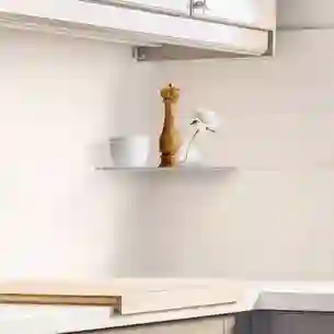 Schlüter-SHELF-E: a practical and elegant corner shelf in the tile backsplash of a kitchen