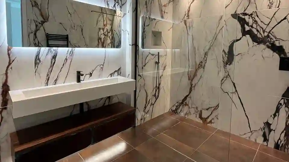 Marble effect tiles perfectly compliment the use of Schlüter products