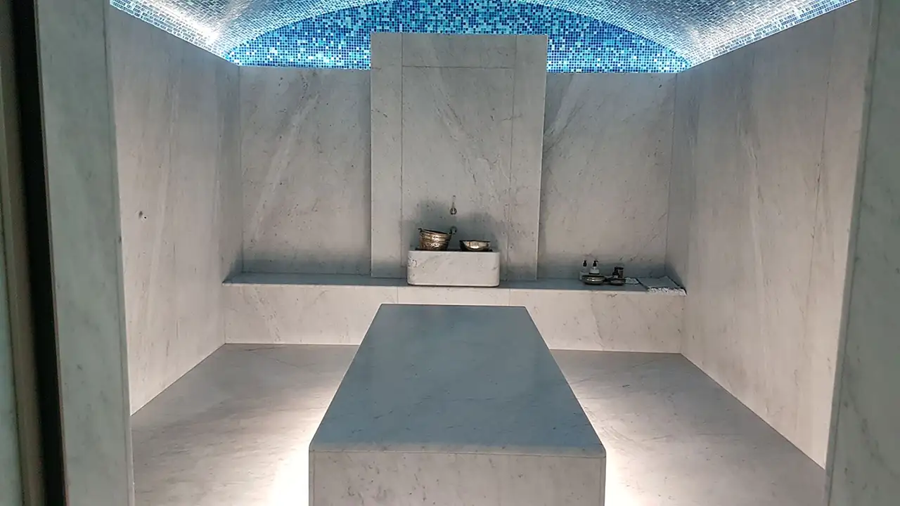 Man walking up stairs lit up using Schlüter-LIPROTEC