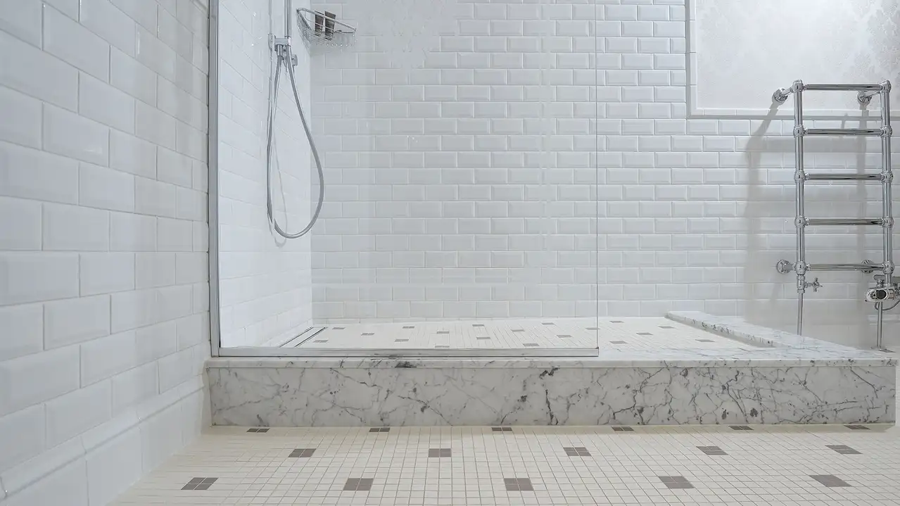 Man walking up stairs lit up using Schlüter-LIPROTEC