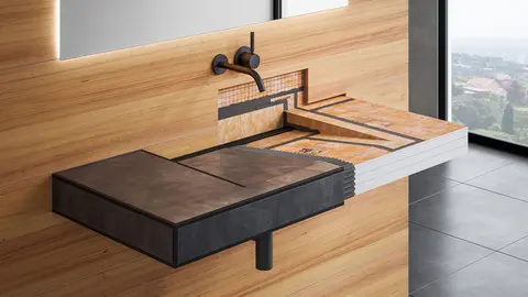 Aan de wand bevestigde wastafel van Schlüter-KERDI-BOARD constructieplaten met zwarte tegels aan één kant