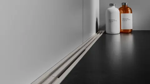 Dusch i golvniv&aring; med den variabla, avkortningsbara duschr&auml;nnan Schl&uuml;ter-KERDI-LINE-VARIO i designvarianten WAVE