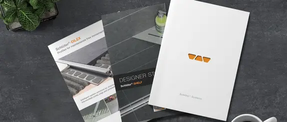 Vy av prospekt kring Schl&uuml;ter-Systems-produkter.