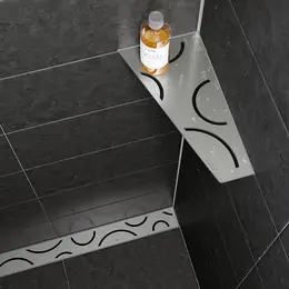 Duschhylla Schl&uuml;ter-SHELF-E och duschr&auml;nna Schl&uuml;ter-KERDI-LINE, b&aring;da i design FLORAL i borstat rostfritt st&aring;l